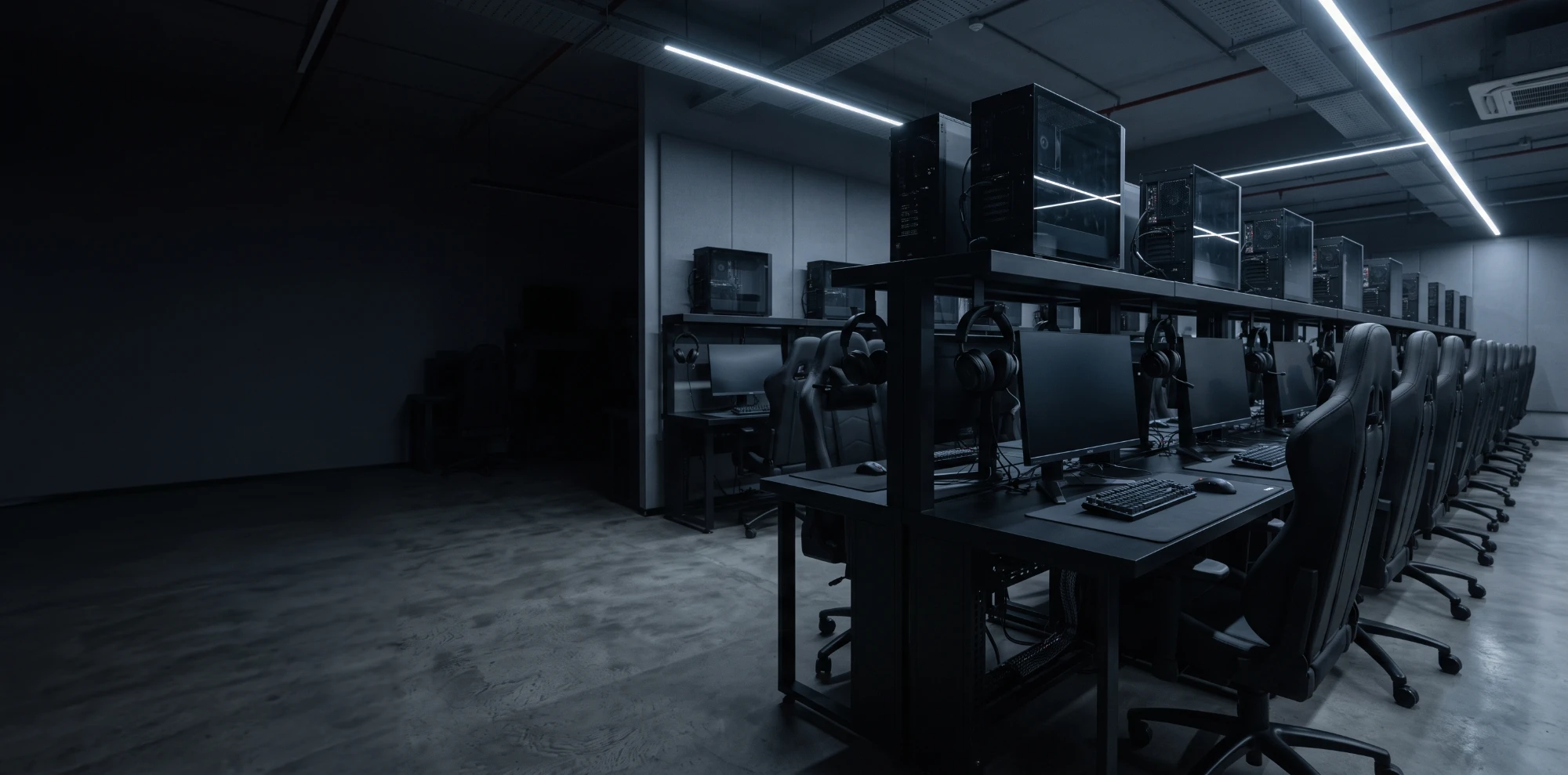 Rows of gaming stations in an esports cafe